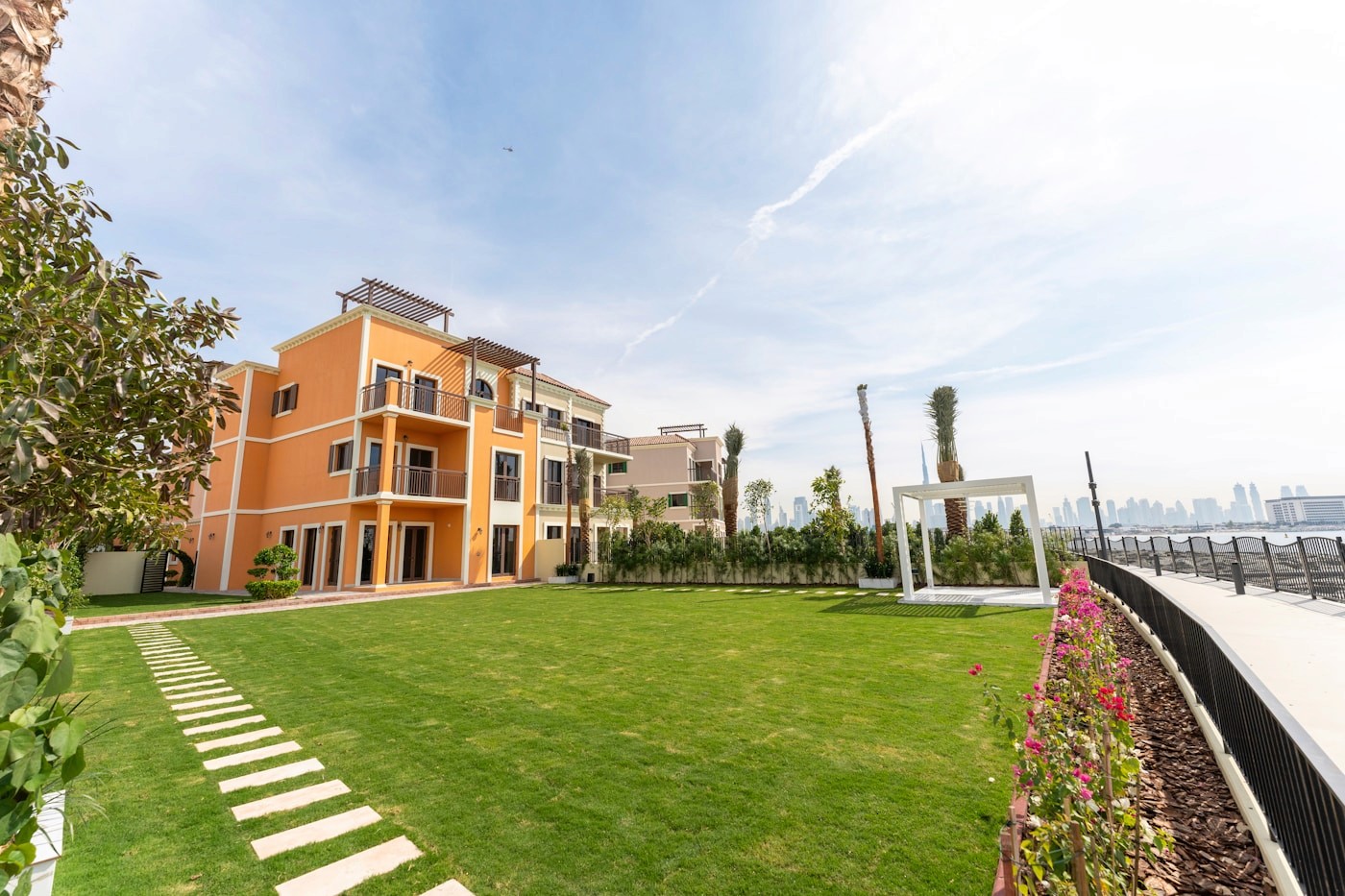 UAE villa community with palm trees